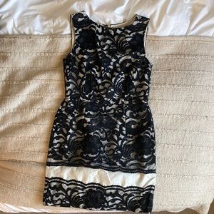The limited lace black and white dress